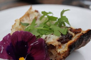 Grilled Flatbread with Caramelized Onions, Manchego Cheese and Micro Greens